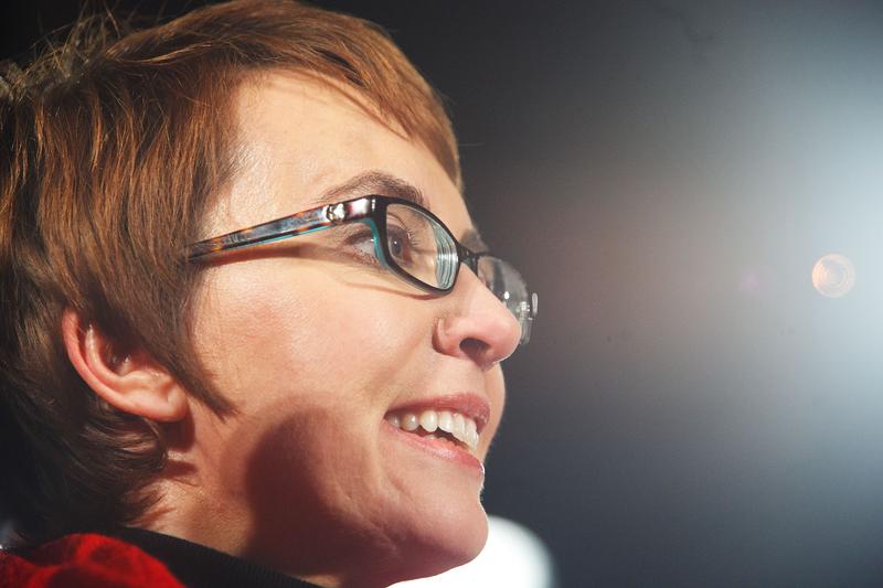U.S. Rep. Gabrielle Giffords (D-AZ) smiles during the 'Remembering January 8th Candlelight Vigil' held at the University of Arizona Mall January 8, 2012 in Tucson, Arizona.
